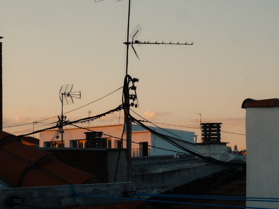 rooftops-and-antennas-against-a-soft-sunset-sky-uhg3-j0z2am
